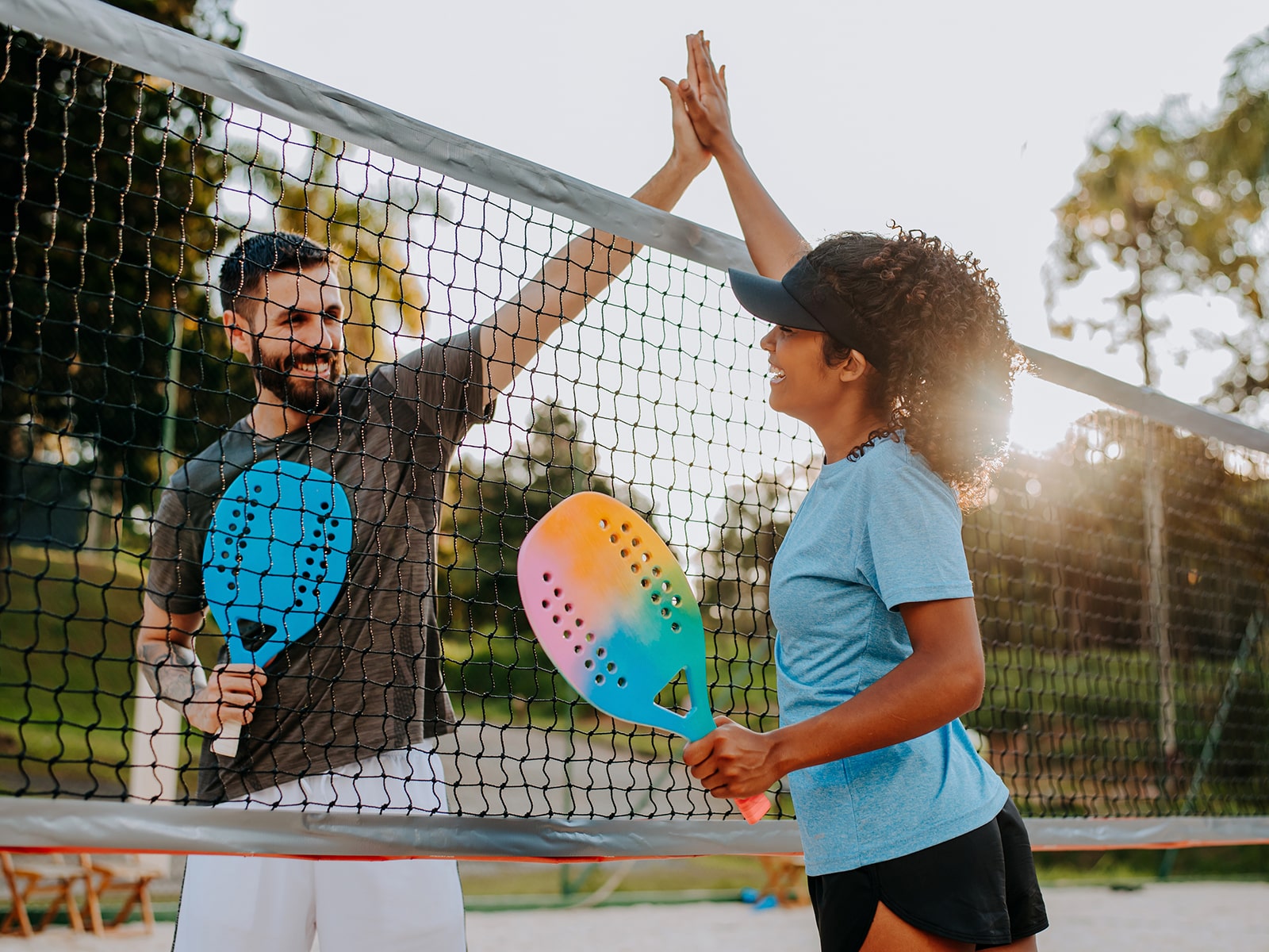 image of people beside a tennis net