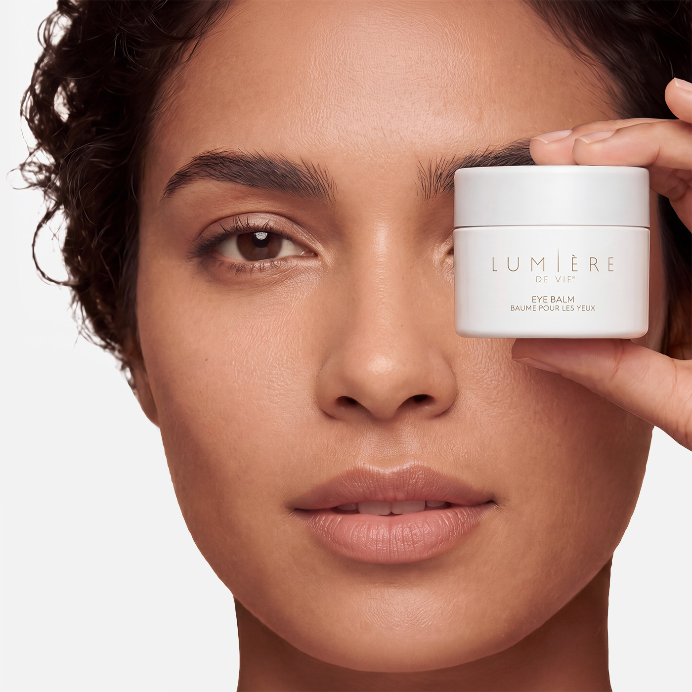 woman with eye revive gels on under eyes