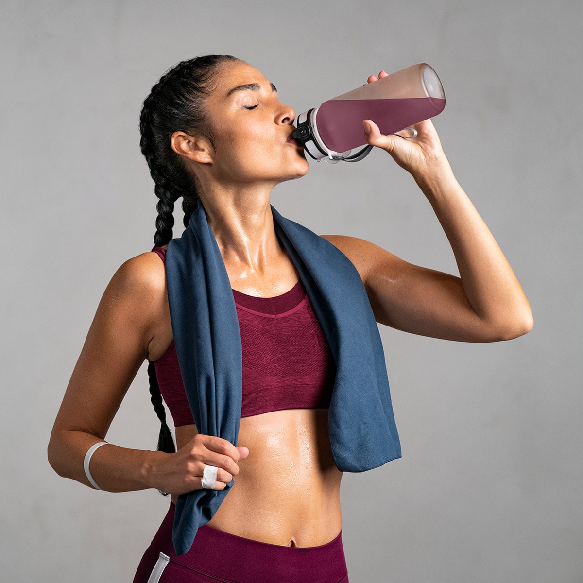 image of woman drinking Isotonix Daily Essentials