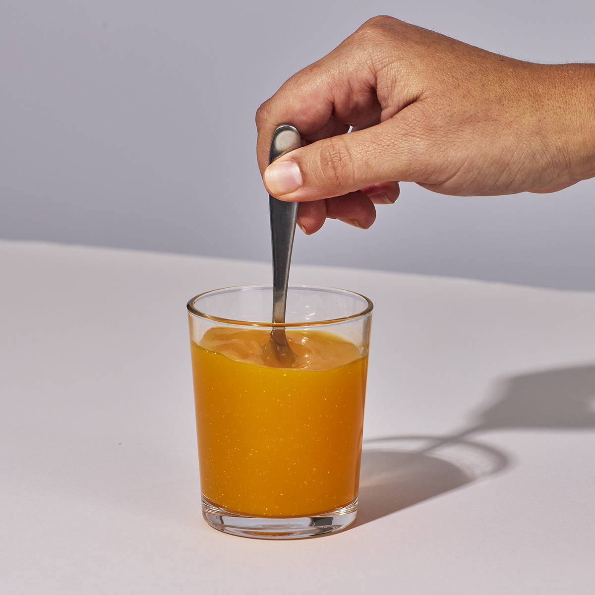image of person mixing a serving of Isotonix Prenatal Activated Multivitamin with water