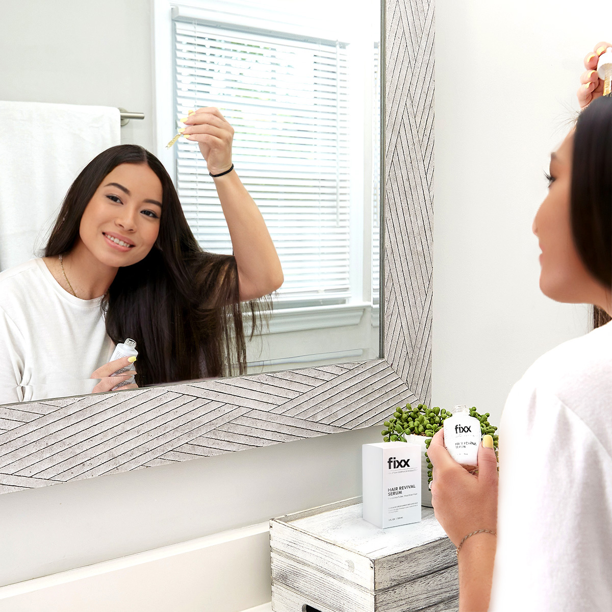 image of woman applying Fixx Revival Serum to scalp
