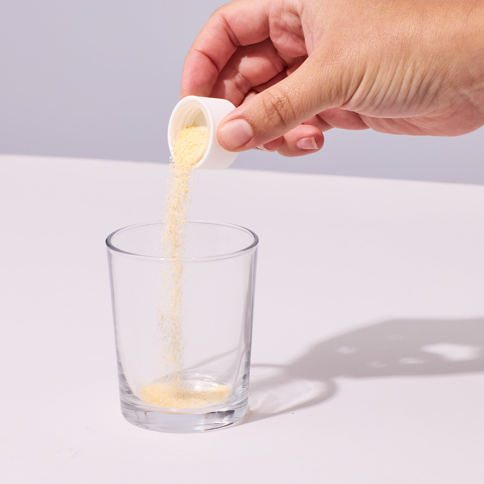 image of powder being added to cup