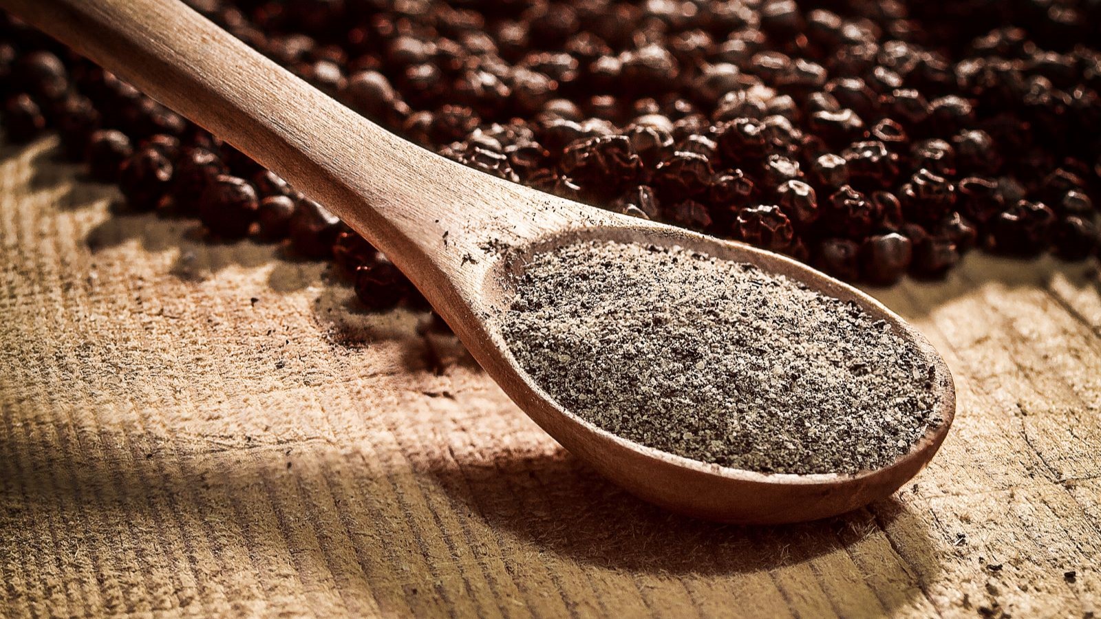 an image of a spoon of black pepper
