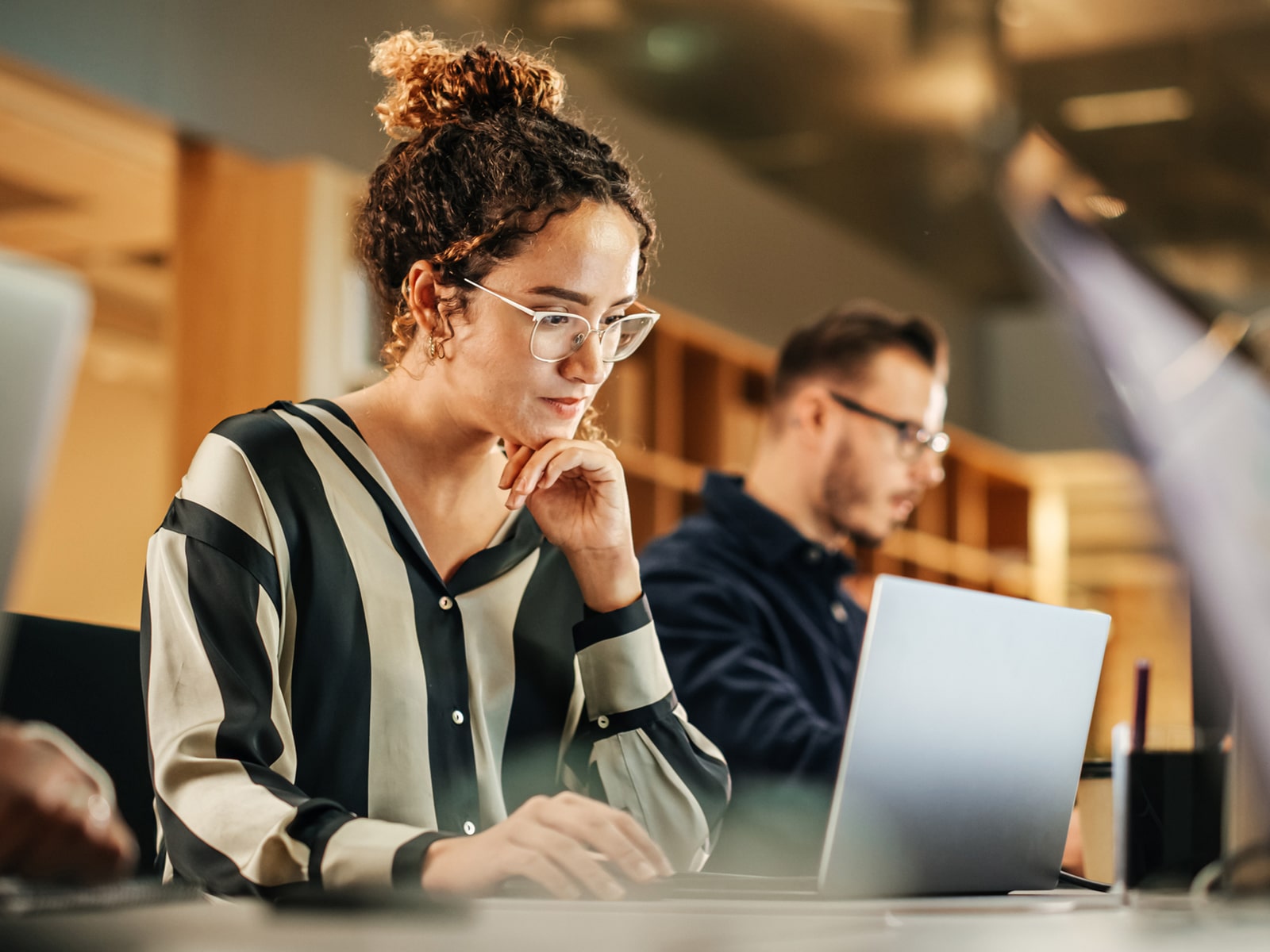 image of a woman working on a laptop