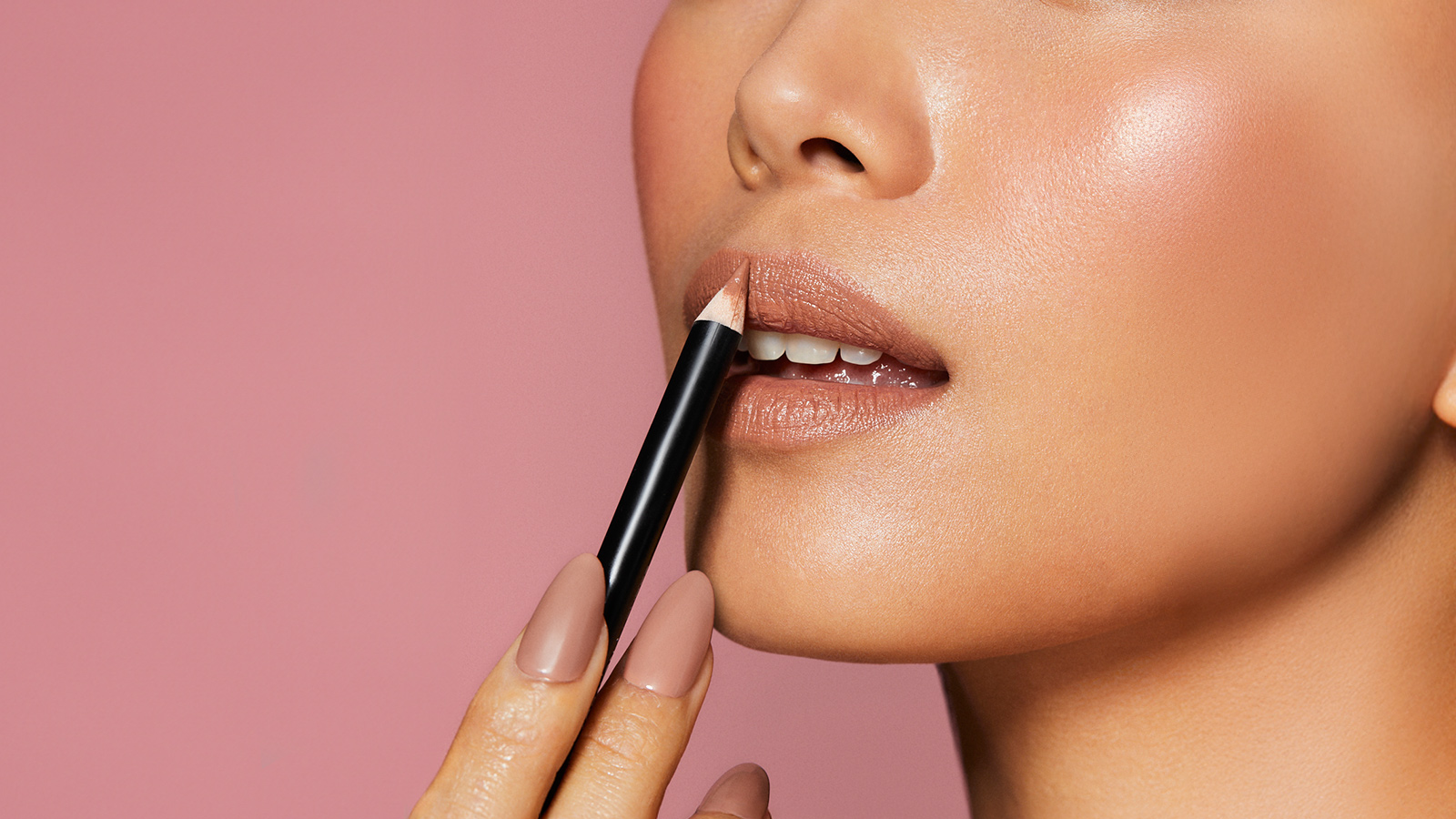 Woman applying lip liner