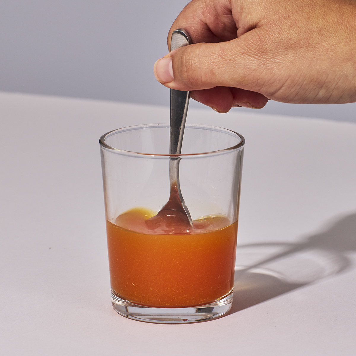 image of person mixing up Isotonix Vision with Lutein powder with water