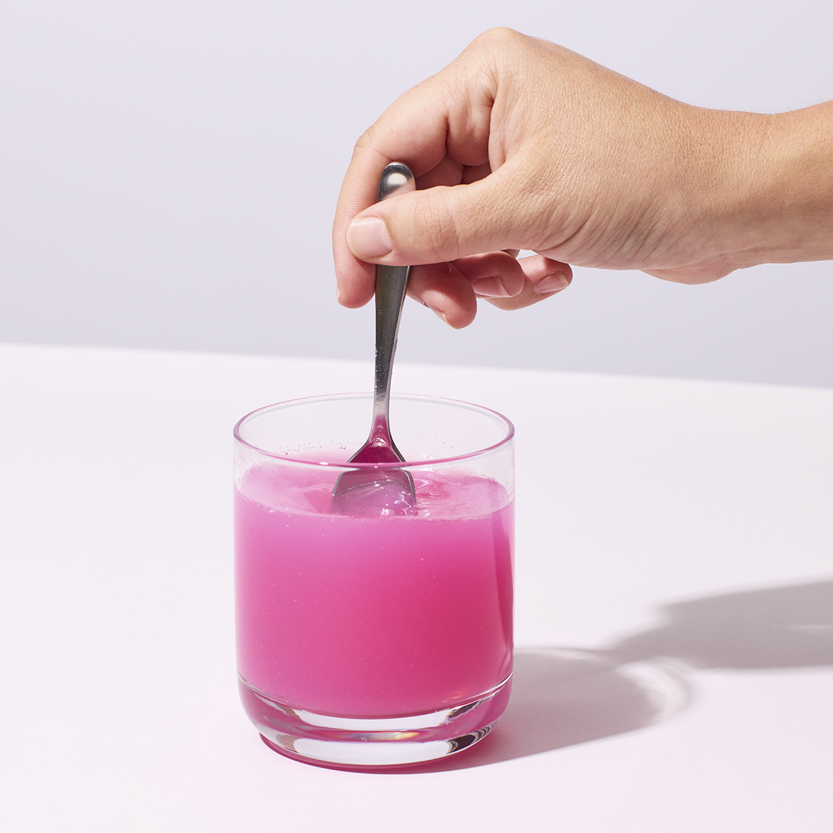image of a person mixing up a serving of Prime Secretagouge with water