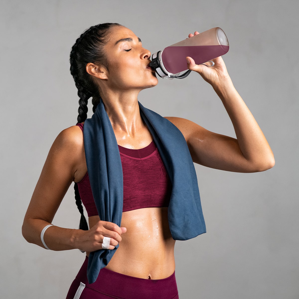 image of woman drinking Isotonix Daily Essentials