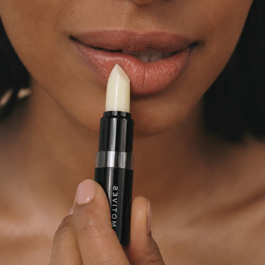 women is holding liptreatment