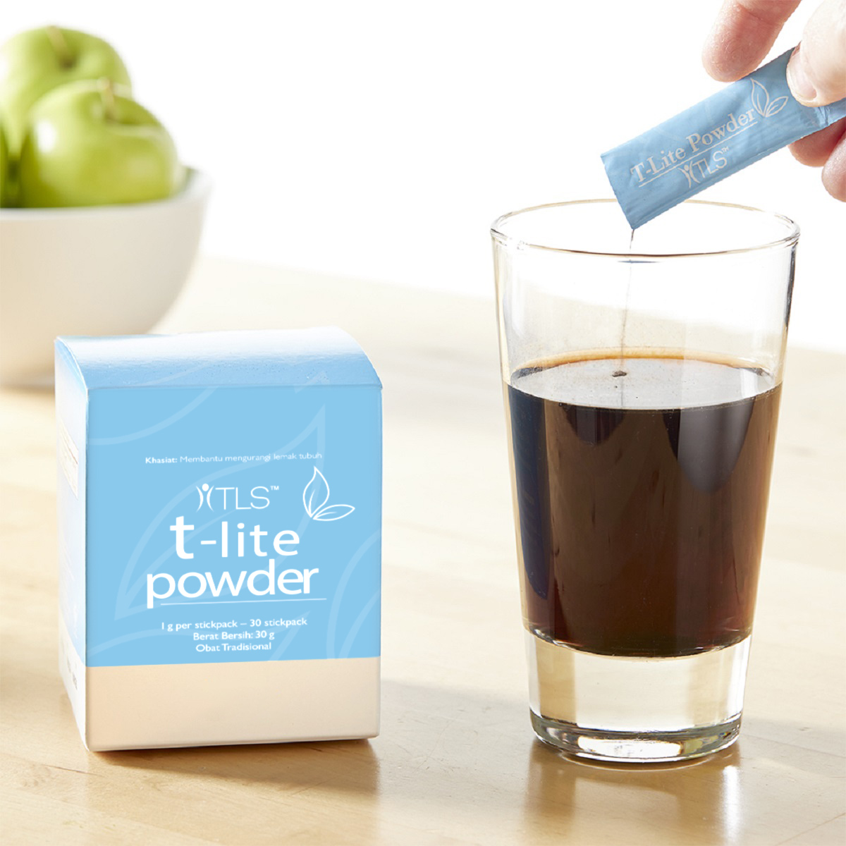 image of person adding packet to a glass