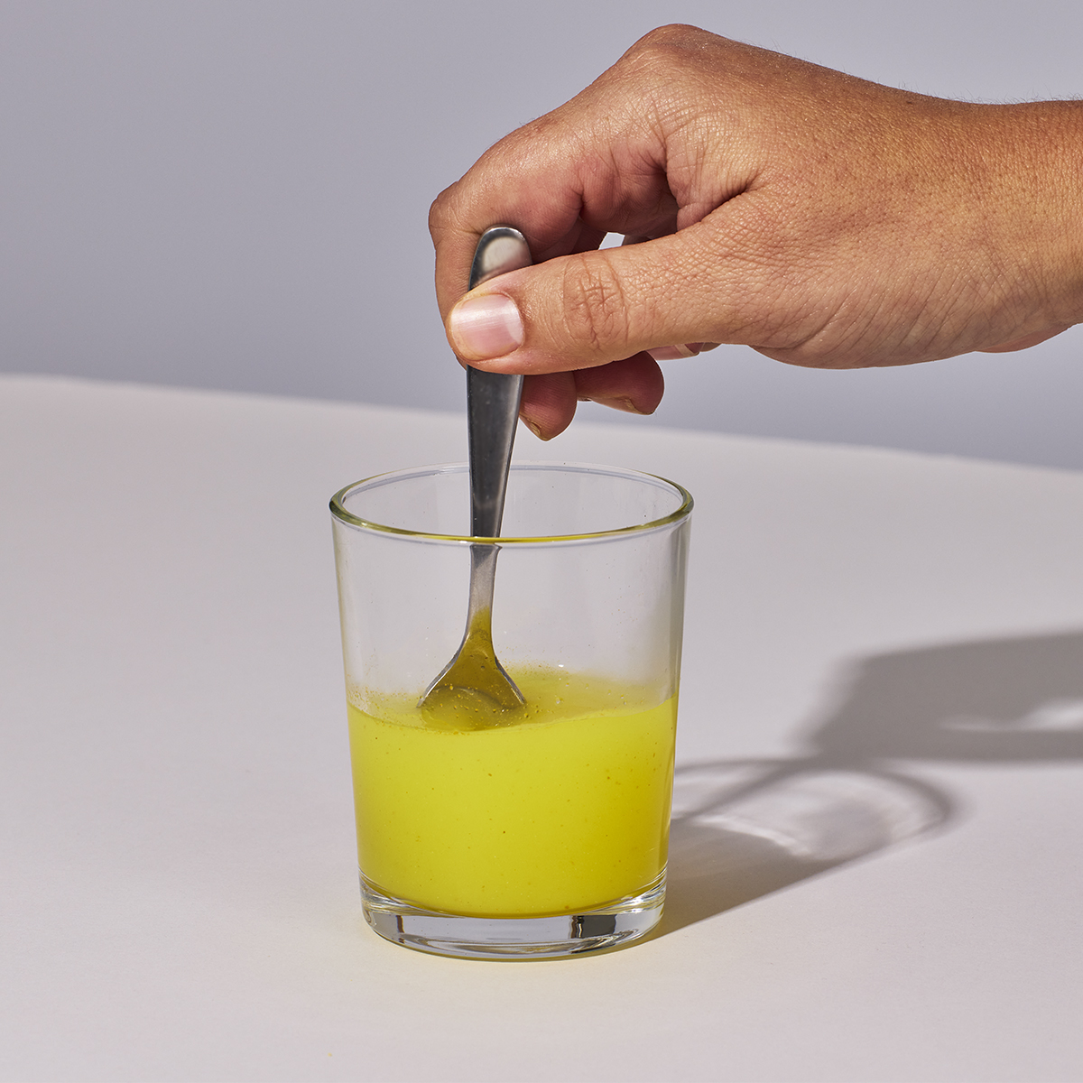 image of person mixing up Isotonix Coenzyme Q10 with water