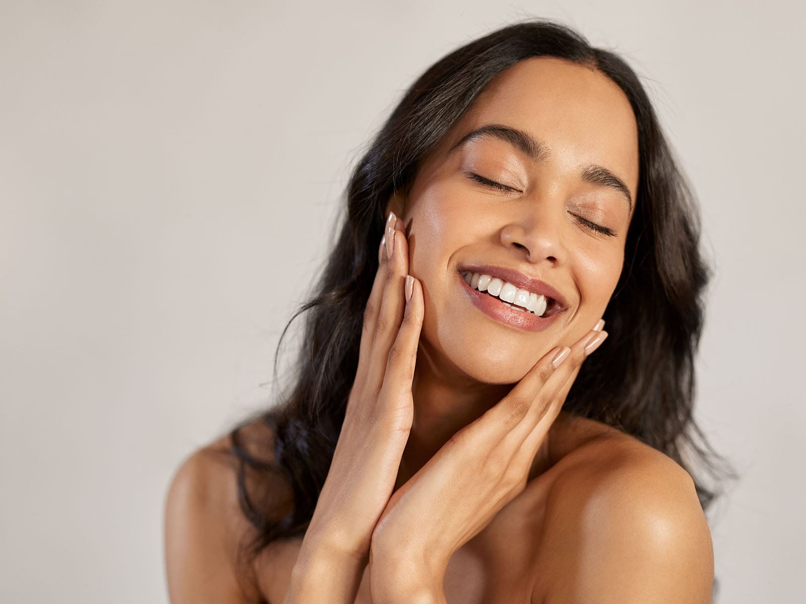 image of a woman with her hands on her face