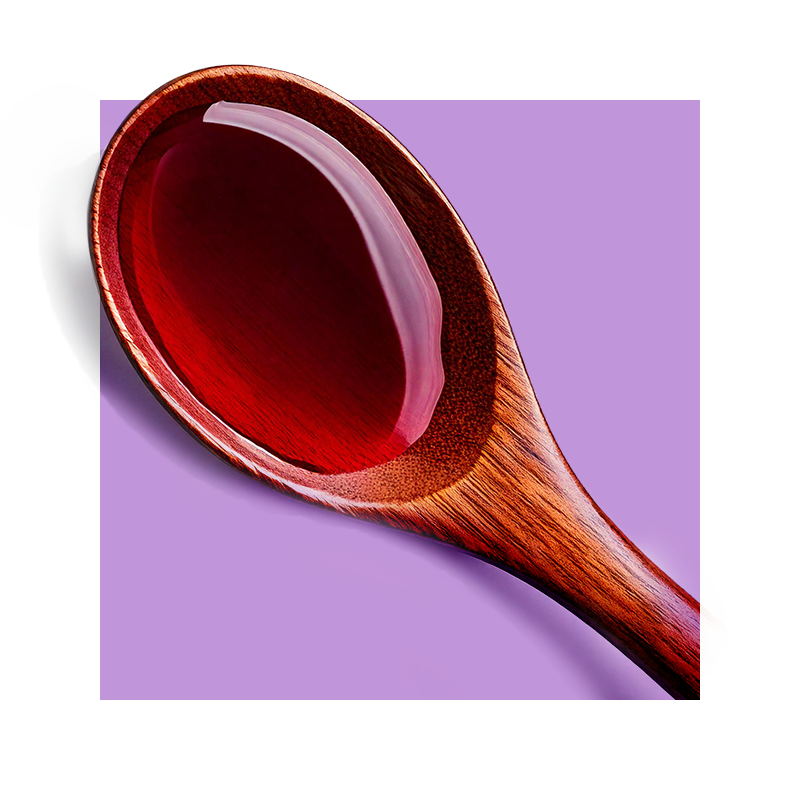 image of red wine in wooden spoon