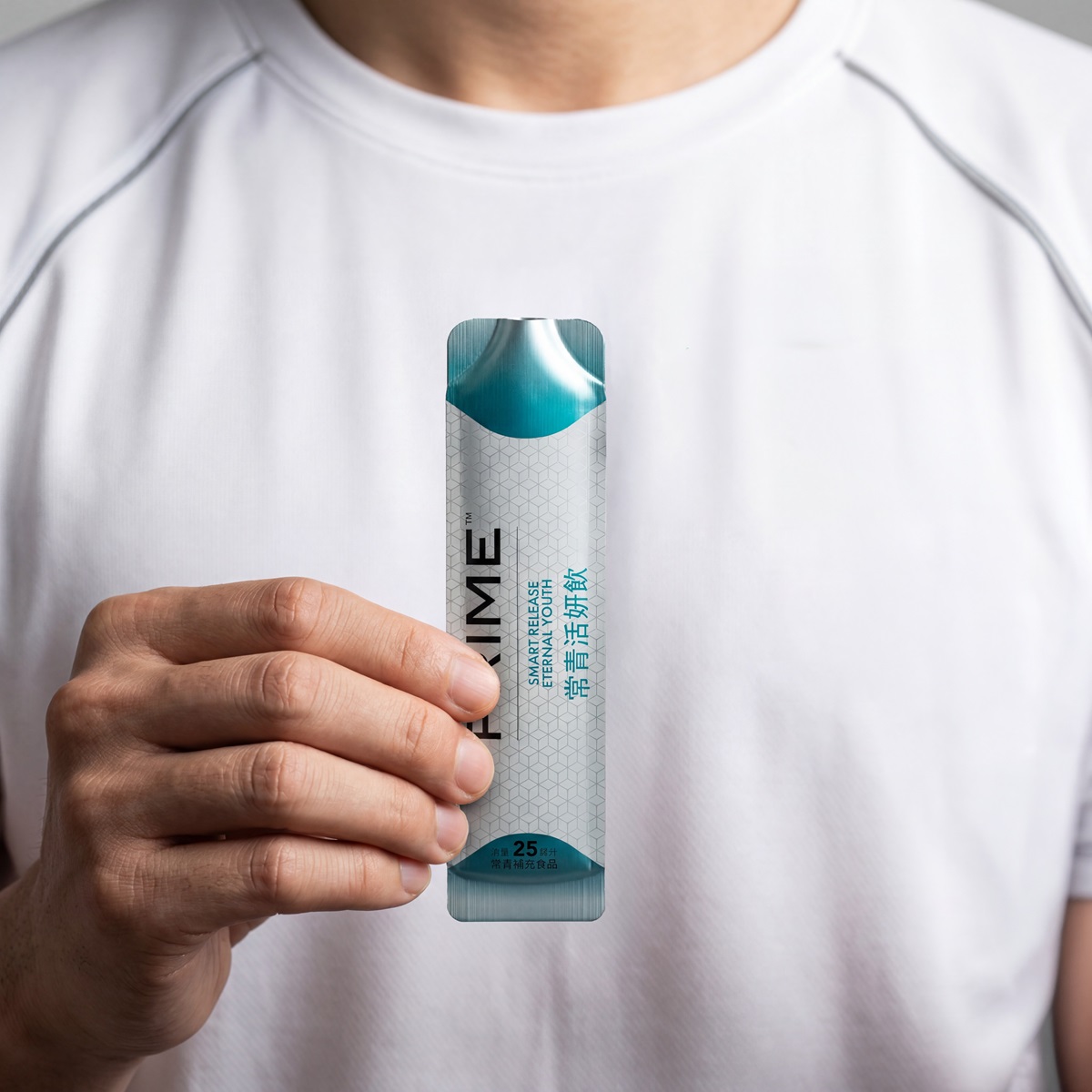 image of man holding sachet of Prime Eternal Youth