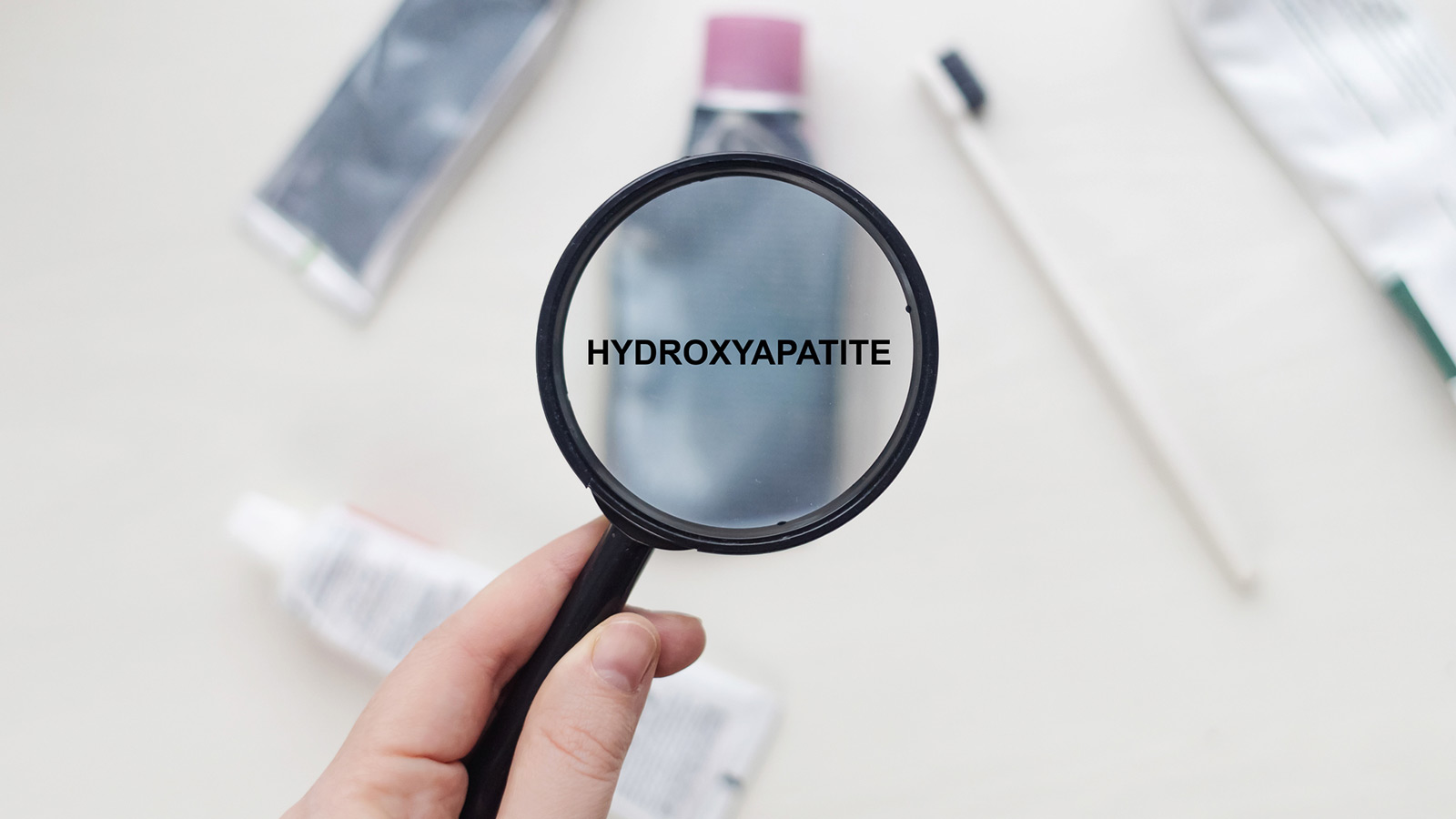 image of the word hydroxyapatite inside a magnifine glass