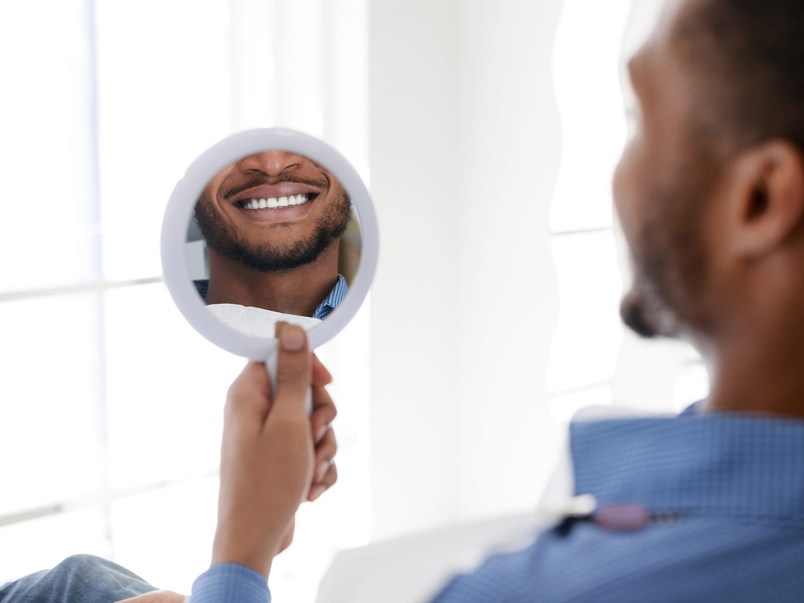 image of person flossing teeth