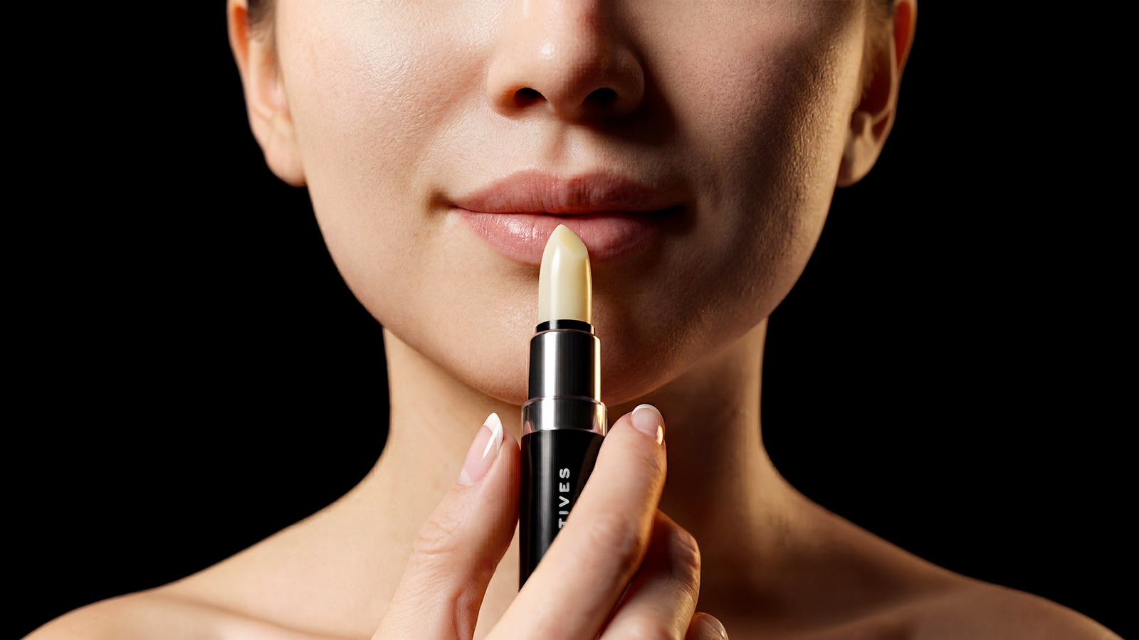 women is applying lip treatment
