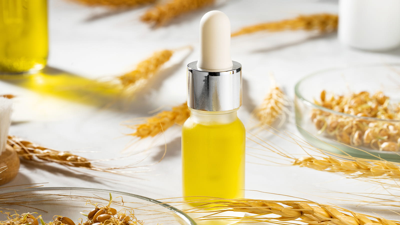 image of heads of wheat with serum bottle