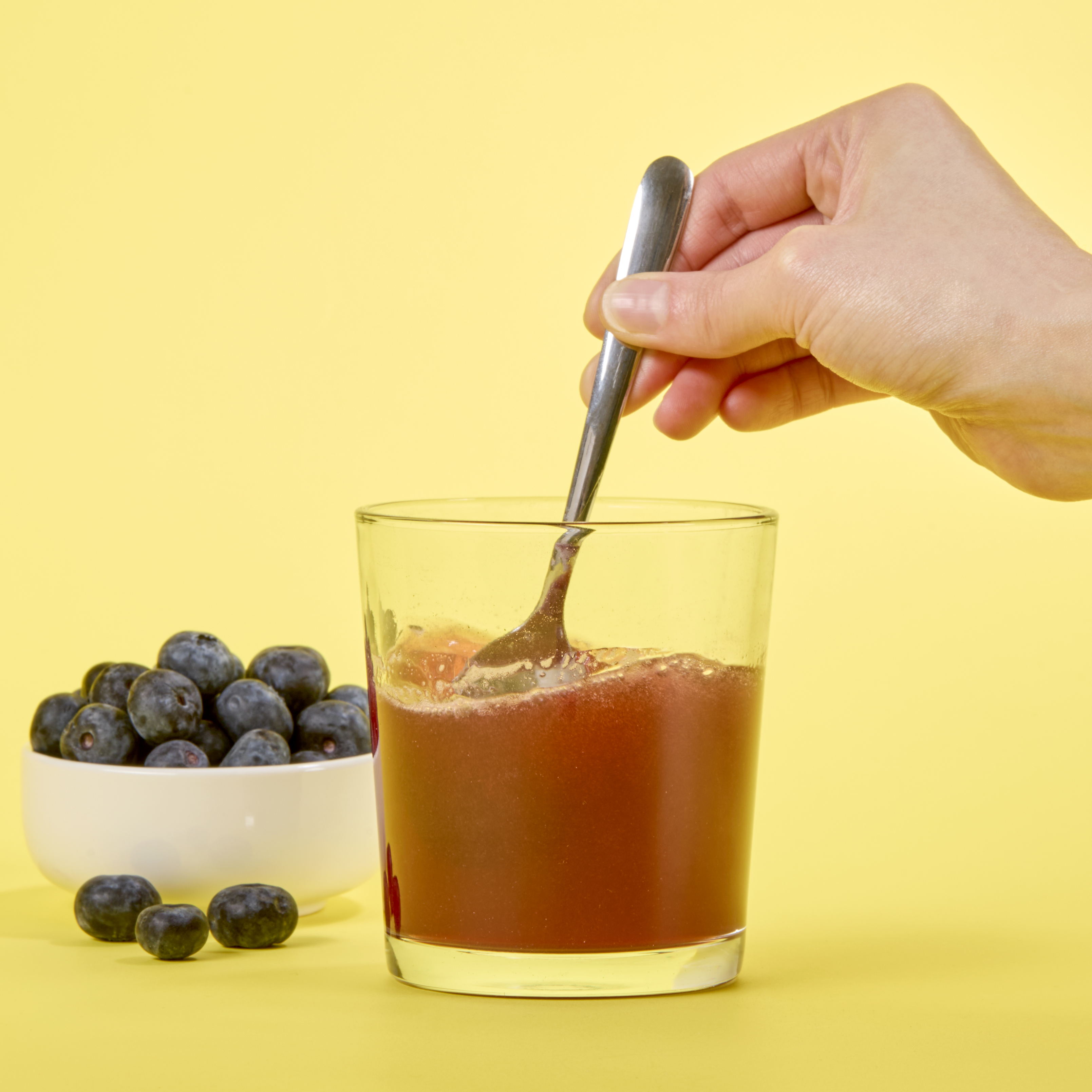 image of someone stirring Isotonix Resveratrol up with a spoon 