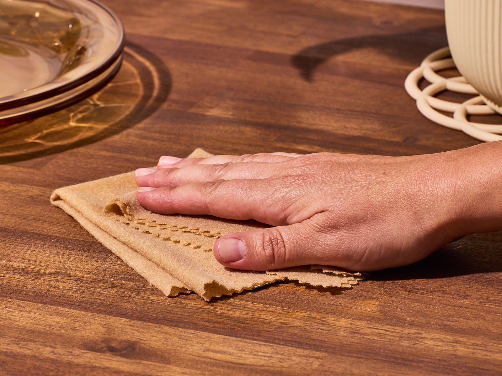 unage of someone wiping a wooden table with a Snap Cloth